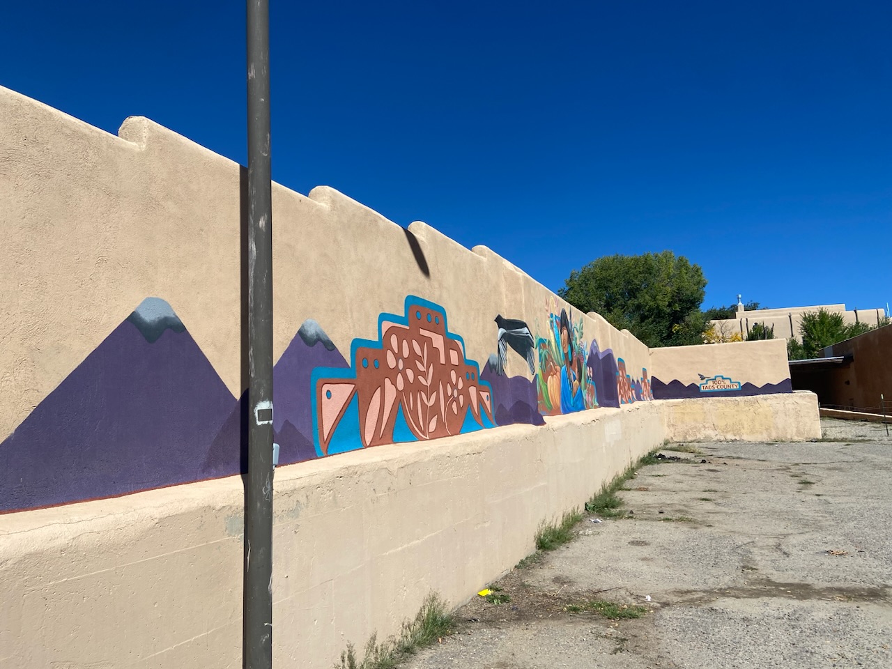 commissioned graffiti art covered wall in Taos, NM